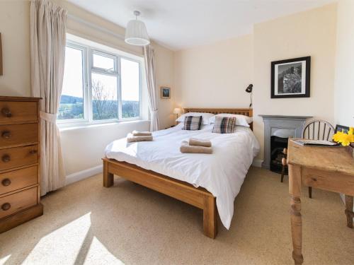 a bedroom with a bed and a desk and a window at 3 bed property in Harrogate District HH057 in Harrogate