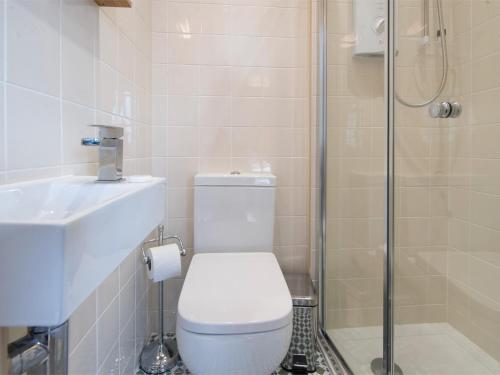 a bathroom with a shower and a toilet and a sink at 3 bed property in Harrogate District HH057 in Harrogate