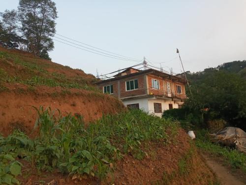 a house on the side of a hill at Unique point home stay in Nagarkot