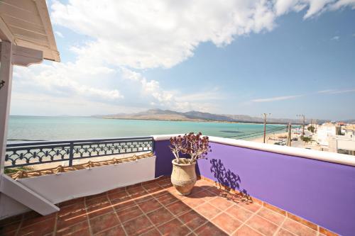 a balcony with a view of the ocean at Coralli Rooms & Restaurant in Elafonisos