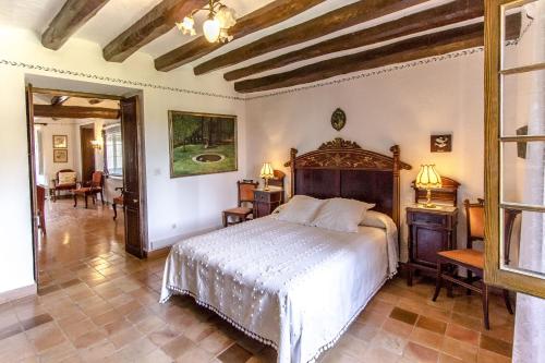 a bedroom with a large bed in a room at Catalunya Casas Unique sanctuary with extra large pool! in Santa Oliva