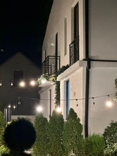 a building with lights on the side of it at night at LARDA TBILISI in Tbilisi City