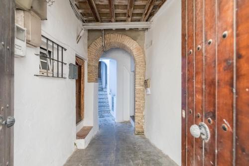 an empty hallway with an archway in a building at BHost - Silos in Tarifa
