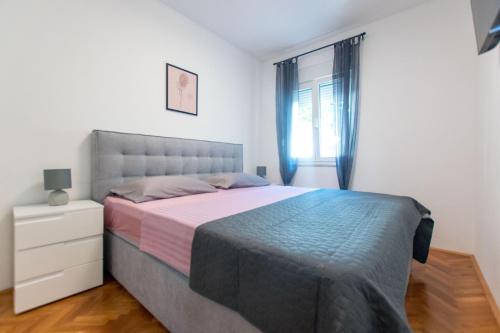 Säng eller sängar i ett rum på Apartment Vinka