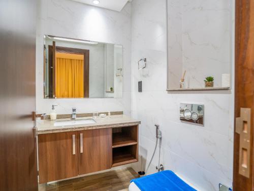 a bathroom with a sink and a mirror at New Arabian 2 Bedroom J One Tower Business Bay in Dubai