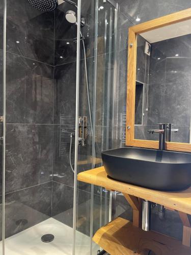 a bathroom with a sink and a shower at Carène in Valloire