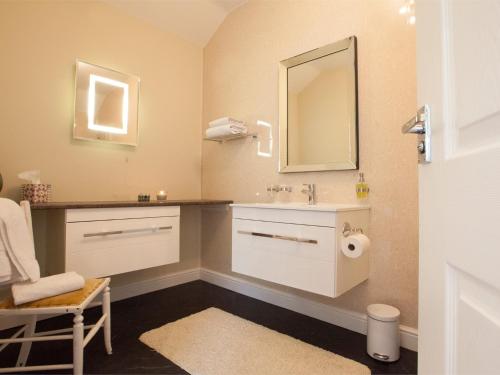 a bathroom with a sink and a mirror at 2 Bed in Howden G0104 in Saltmarshe