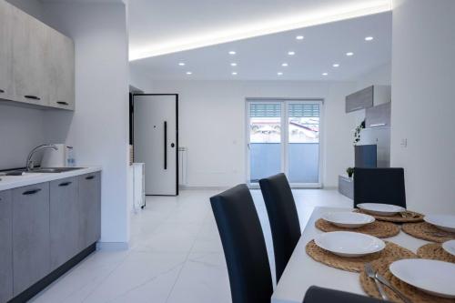 Virtuvė arba virtuvėlė apgyvendinimo įstaigoje ANSIRO Rooms Home Business