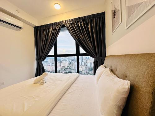 a bedroom with a bed with a large window at New 2BR or 3BR Cozy Urban Suite Homestay at Georgetown8-10pax by URBAN STAYCATIONS LOD in Jelutong