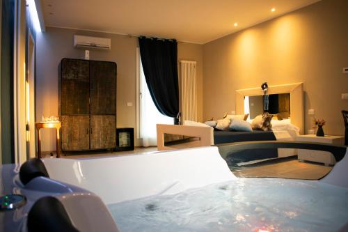 a living room with a tub in the middle of a room at B&B Sulla Rupe in Gravina in Puglia