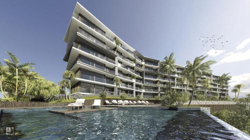 an apartment building with a pool in front of it at Vista Mar - AC, Parking and pool in Funchal