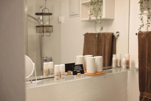 a bathroom counter with candles and a mirror at Haus Meierhüsli in Malans