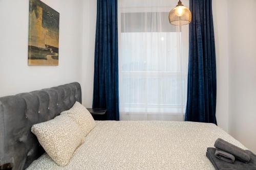 Ένα ή περισσότερα κρεβάτια σε δωμάτιο στο Central Station Apartment No4