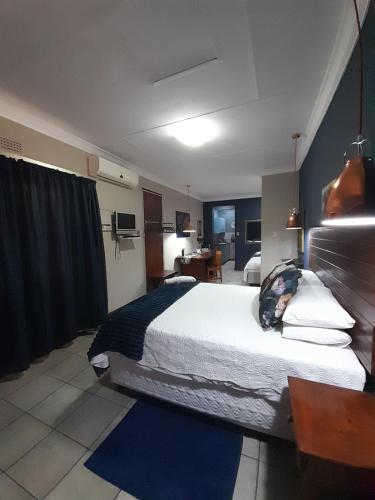 Ένα ή περισσότερα κρεβάτια σε δωμάτιο στο Ebenezer Self Catering