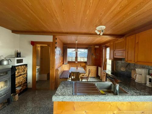 a kitchen with a sink and a table in it at Alpenparadies in Gampel