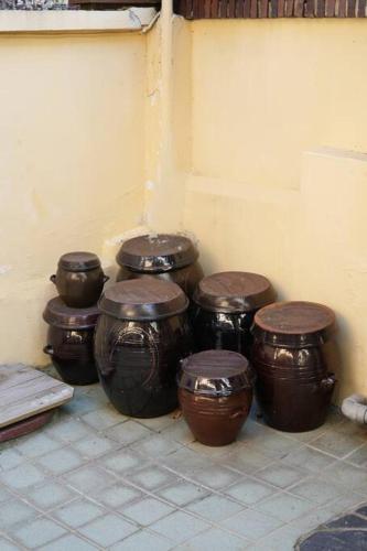 a group of four drums sitting next to a wall at Stay Vibe Healing House in Seoul