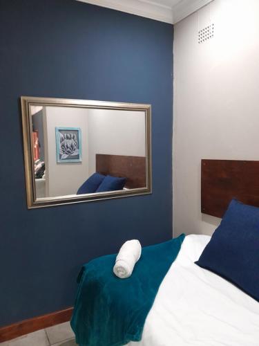 Ένα ή περισσότερα κρεβάτια σε δωμάτιο στο Ebenezer Self Catering