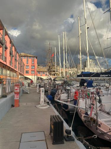 a group of boats docked in a marina at Porto Antico Boat in Genova