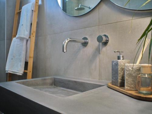 a sink with a faucet in a bathroom at Nostos Luxury Villas with Private Pool in Nafpaktos in Nafpaktos