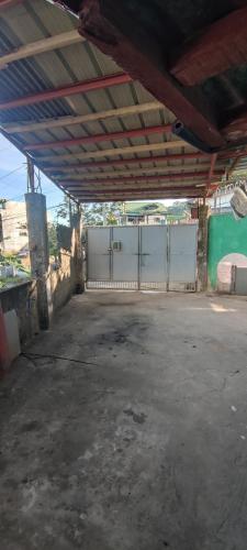 an empty parking lot in a building with a fence at LE Transient Homes - SC in Baguio