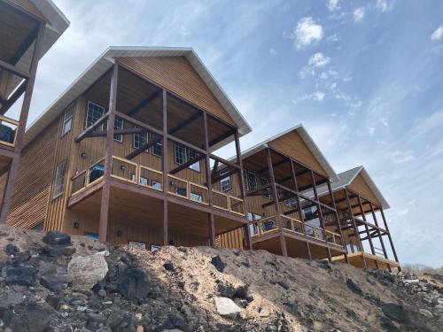 a large wooden building on top of a hill at Keweenaw Waters Resort in Houghton
