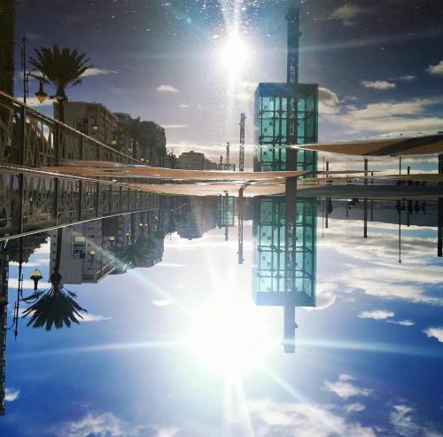 a reflection of the sun in a pool of water at Tanger Malabata in Tangier