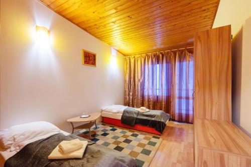 a hotel room with two beds and a window at Horská chata Smrekovica in ľubochňa