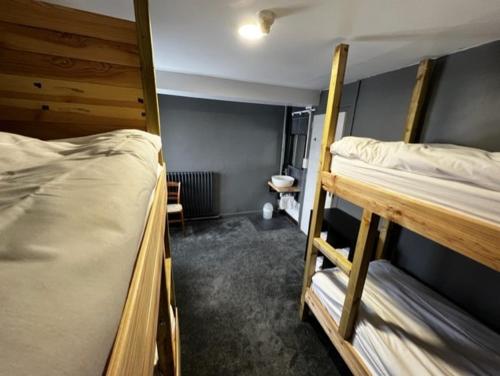 a dorm room with two bunk beds in it at RestAuberge La Reine Meije in La Grave