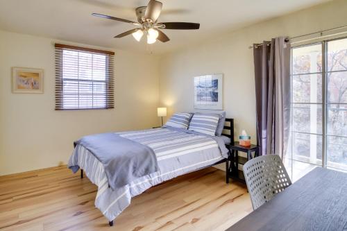 a bedroom with a bed and a ceiling fan at Cozy Albuquerque Apartment Less Than 1 Mi to Downtown! in Albuquerque