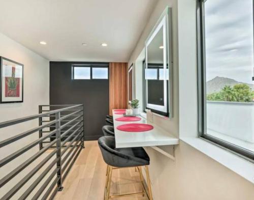 a home office with a red table and chairs at Perfect Friends Escape in Old Town Scottsdale with Resort Pool Access and Roof Deck! in Scottsdale