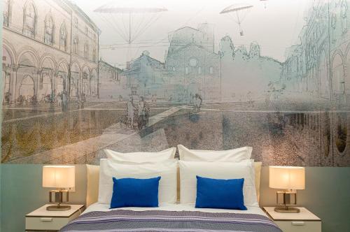 une chambre avec une fresque murale représentant une ville dans l'établissement B&B I Tigli sul Navile, à Bologne