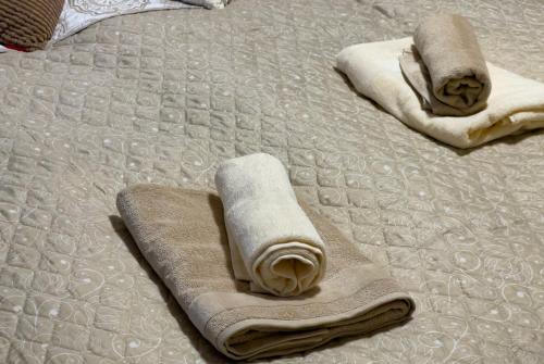 two towels are laying on a bed at Rezidence My Mozart in Prague
