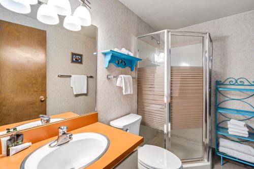 a bathroom with a sink and a shower at Sunny, Spacious & Pet Friendly - Creekside #39 in Bear Valley