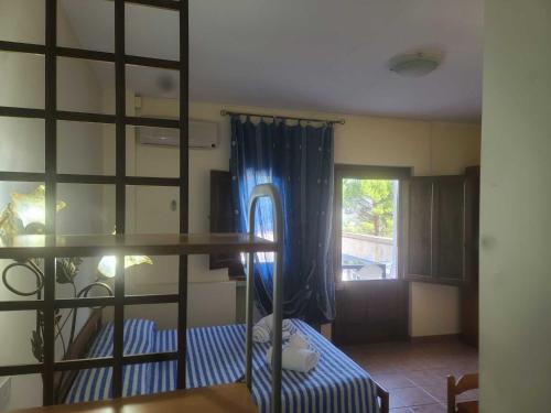 a room with a bunk bed and a table at Riccio - La Cantina del contadino in Rende