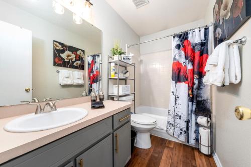 a bathroom with a sink and a toilet at Home Away From Home with King Bed, WiFi and Lots of Amenities in Killeen