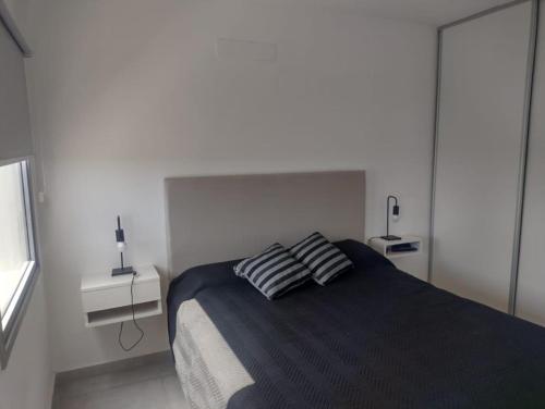 En eller flere senge i et værelse på Al Mar Torres del Este - Monte H del Este