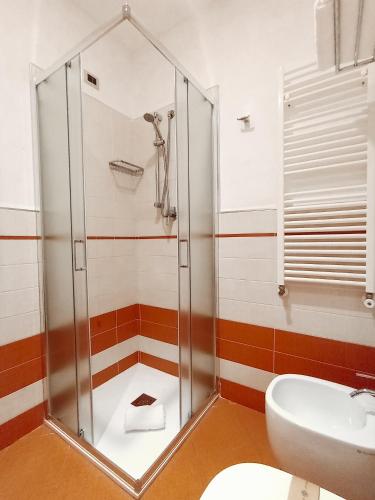 a bathroom with a shower and a sink at Pietre Nere Resort & Spa in Modica