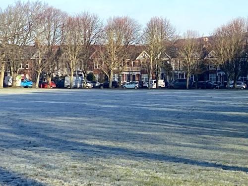 a large parking lot with trees and houses at Tranquility in Worthing