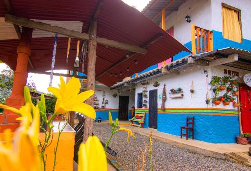a house that is painted blue and white at Casa Viva Alojamiento Rural in Jardin