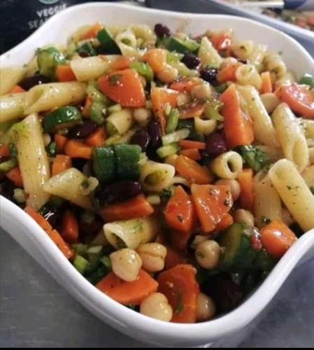 a bowl of pasta salad with beans and vegetables at Tamboti Guest Lodge in Pretoria