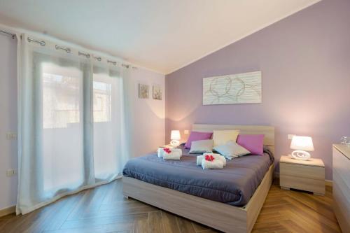 Llit o llits en una habitació de Suite Mimì Casa vacanza Cagliari