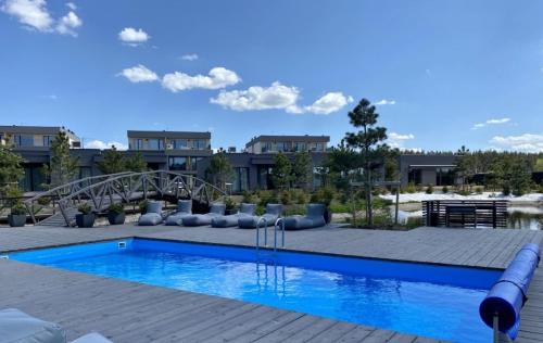 a swimming pool at a resort with a resort at Ladies Group apartments Palanga Mano jūra 2 apartamentai 74G-2 in Palanga