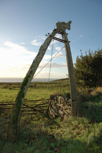an old arch in the middle of a field at Craiglea Lodge in Latheron