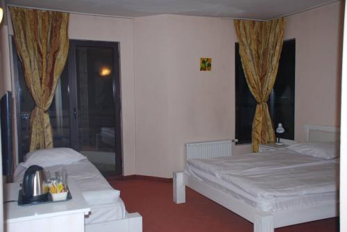 Postel nebo postele na pokoji v ubytování Guest House ANEX