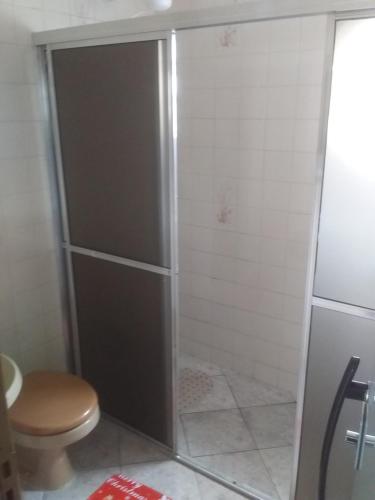 a shower stall with a toilet in a bathroom at Hospedaria Chaves in Brasilia