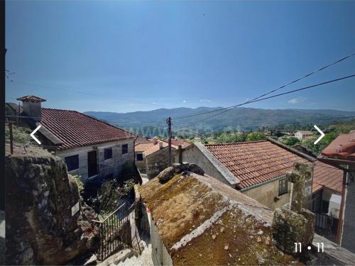 an aerial view of a town with roofs at Casa penedo do bento in Soajo