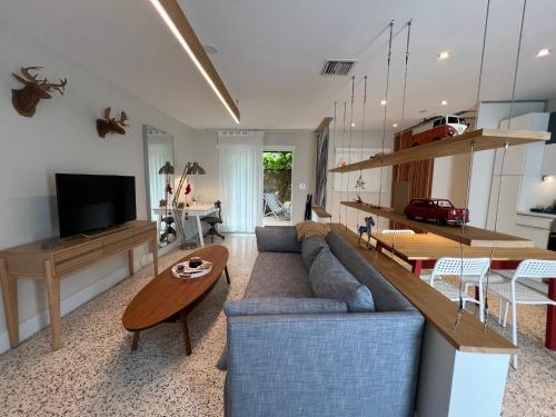 a living room with a couch and a table at Cozy house close Brickell in Miami