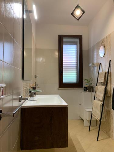 a bathroom with a sink and a toilet at Kite Village Solaris in Birgi Vecchi