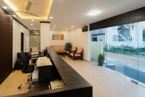 an office with a reception desk and a lobby at Hoppers Stop Yelahanka in Bangalore