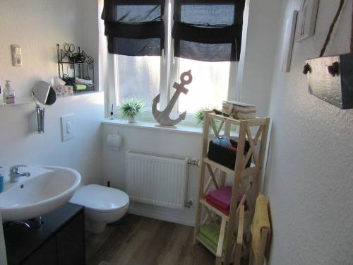Koupelna v ubytování Komplett ausgestattetes Apartment , Ebbe und Flut